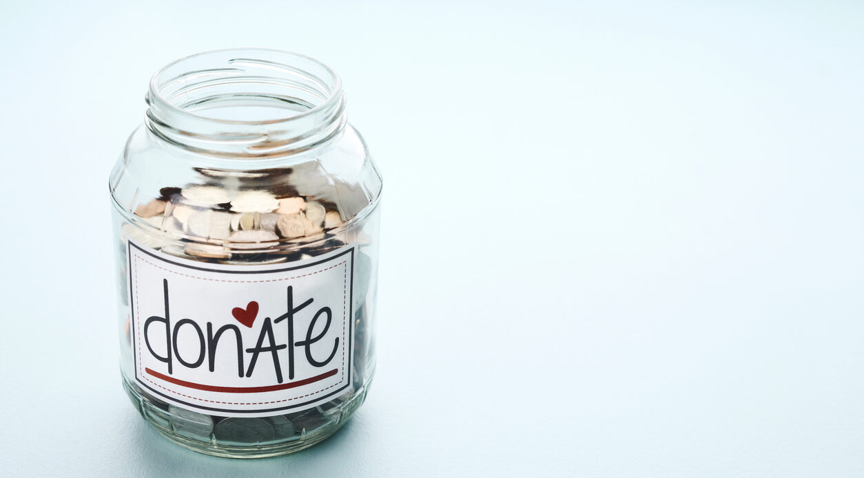 American currency in a donation jar